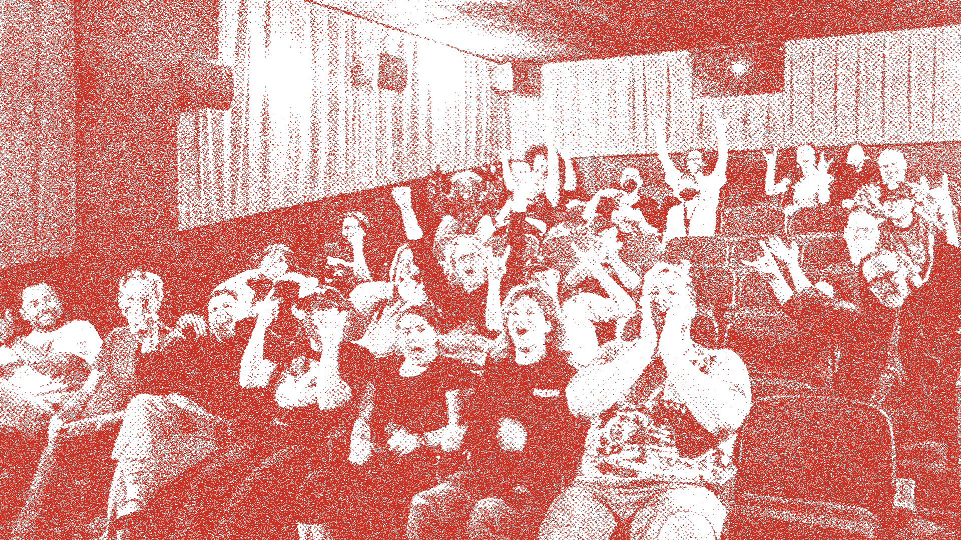 The Beacon's auditorium — rows of red and blue seats facing the curtained screen